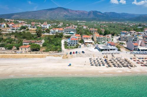 an aerial view of a beach with a resort at OzioMari Suites in Limenaria