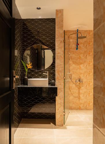 a bathroom with a sink and a mirror at Jolia Nha Trang Hotel in Nha Trang