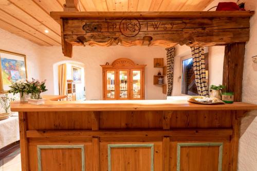 a kitchen with a wooden counter in a house at Kinderparadies Bachbauer in Mondsee