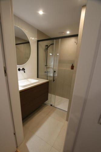 a bathroom with a sink and a shower at Ostoja in Ojców