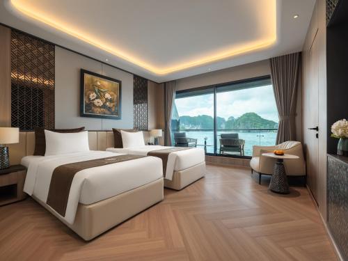 two beds in a hotel room with a large window at Azura Cruise in Ha Long
