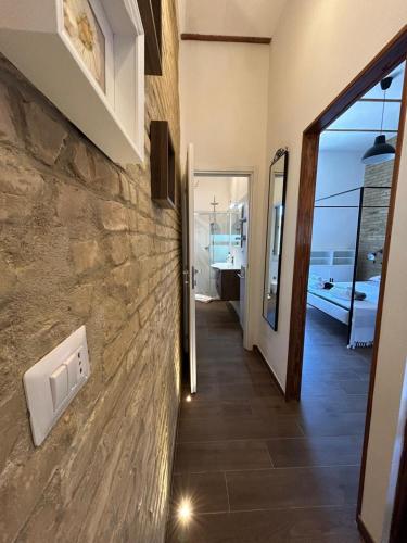 a hallway of a house with a stone wall at RELAIS dei TRABOCCHI in Casalbordino