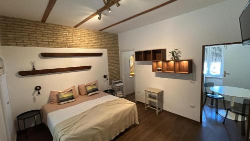 a bedroom with a bed and a table in it at RELAIS dei TRABOCCHI in Casalbordino