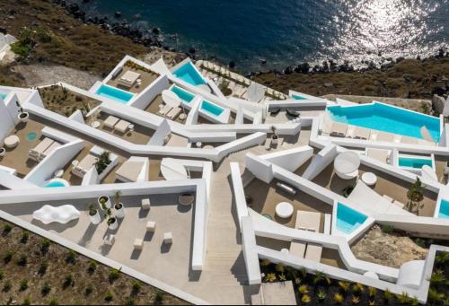an aerial view of a resort with the ocean at Saint Santorini in Oia