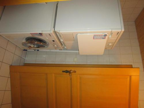 a kitchen with a counter top with a stove at Schneiderhof in Rimsting