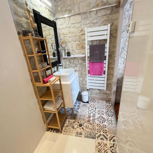 a bathroom with a sink and a mirror at Saint James House in Pons