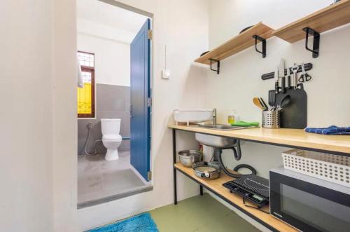 a bathroom with a sink and a toilet at Bang Chak 1 Bedroom apartment in Bangkok
