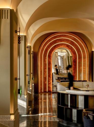 a hallway with an archway in a building at Xiamen Lujiang Harbourview Hotel-panoramic sea views over Gulangyu in Xiamen