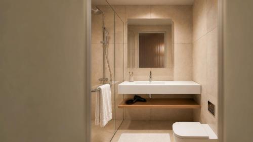 a bathroom with a sink and a toilet at Stey Stavanger in Stavanger