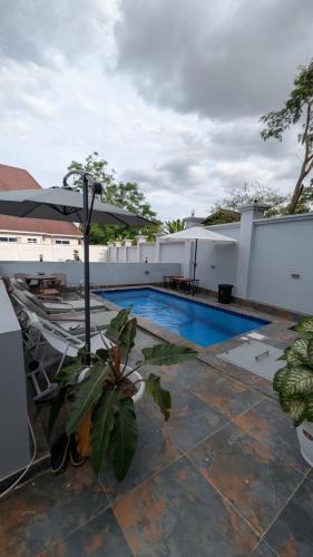 a view of a swimming pool on a house at Akibo Residency Apartment in Mwanza