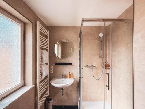 a bathroom with a shower and a sink at Doras Ferienhaus in Bad Reichenhall