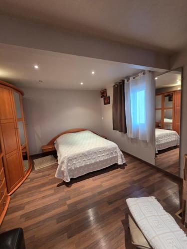 a bedroom with two beds in a room at Chez André in Cognac