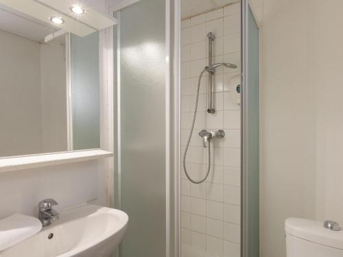 a bathroom with a shower and a sink at Hôtel F1 Reims Tinqueux in Reims