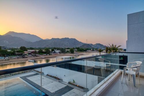 a balcony with a view of the mountains at 3BR villa BBQ Pool and Maidroom near diving center Dana Island in Sharm