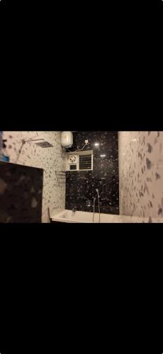 a bathroom with a sink and a mirror at La reve ecr , Panaiyur in Chennai