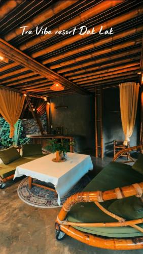 a room with a table and a sign that reads the wire next did last at Tre Vibe Resort Daklak in Buôn Jung