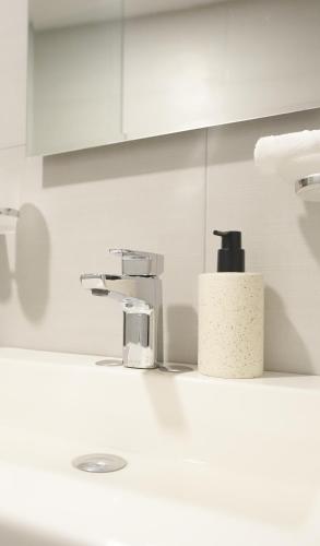 a bathroom counter with a sink and a faucet at Casa las Castellanos in Tlalixtac de Cabrera