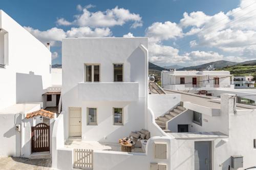 a view of a white house with stairs at Elaia Home luxury village apartment for two Naxos in Galini