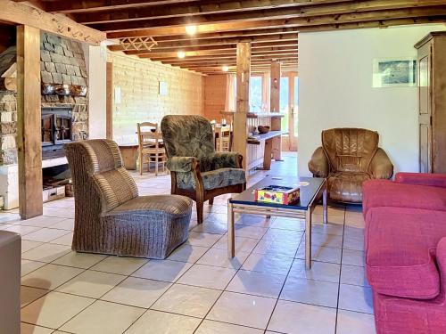 a living room with couches and chairs and a table at Chalet Chalet Anthamatten-3 by Interhome in Champéry