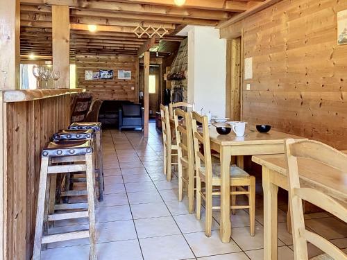 a kitchen with a table and chairs in a room at Chalet Chalet Anthamatten-3 by Interhome in Champéry