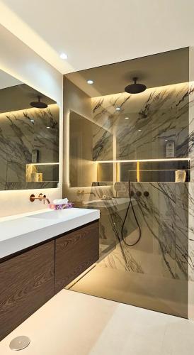 a bathroom with a sink and a shower at Coral Beach Aparthotel in Marbella
