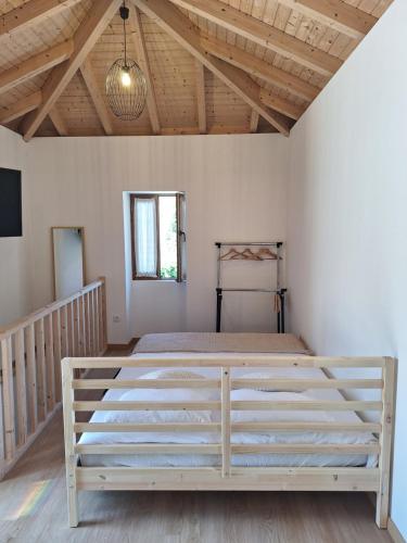 a bedroom with a large bed in a room at Villa Barbosa in Quintiães