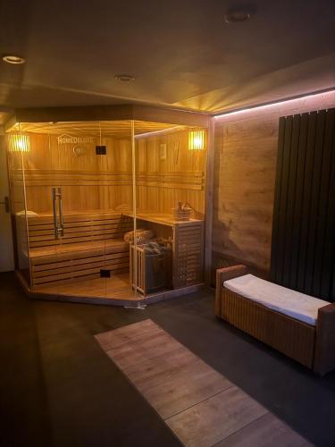 a room with a large tub with a bed in it at Ferienoase am See in Möhnesee