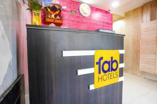 a frito lay store front with a yellow sign on it at Via Palace Residence in Mumbai
