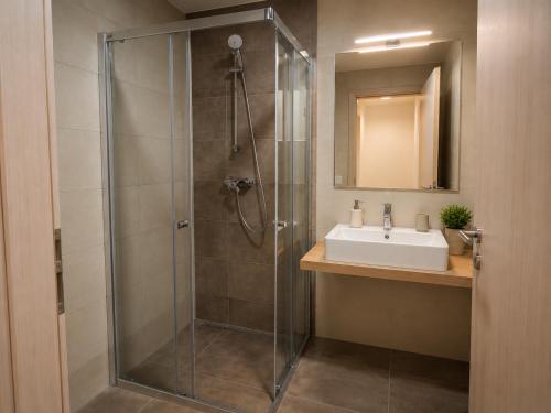 a bathroom with a shower and a sink at Apartmán PERLA 28 Říčky v Orlických horách in Říčky