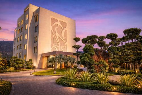 a building with a painting on the side of it at Hillcrest Hotel & Resort, Abu Road in Ābu Road