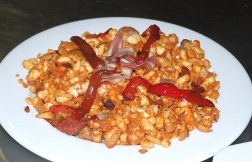 a white plate of food with ketchup and food at Hotel Rural Carlos I in Garganta la Olla