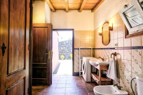 a bathroom with a sink and a mirror at Sabina in Mazo