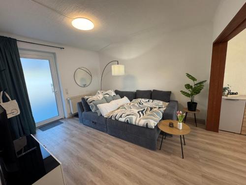 a living room with a couch and a table at Zur Sonnenseite in Oberthal