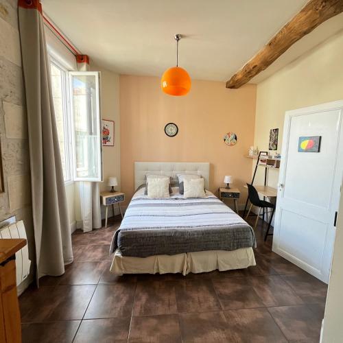 a bedroom with a bed in a room at Saint James House in Pons