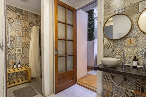 a bathroom with a sink and a mirror at Casa Lima Sur in Buenos Aires
