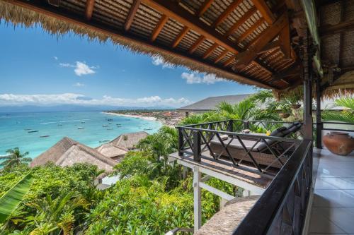 a view of the ocean from the balcony of a resort at Villa Atas Lembongan in Nusa Lembongan