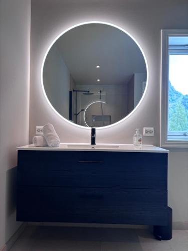 a bathroom with a sink and a mirror at Stryn Panorama in Stryn