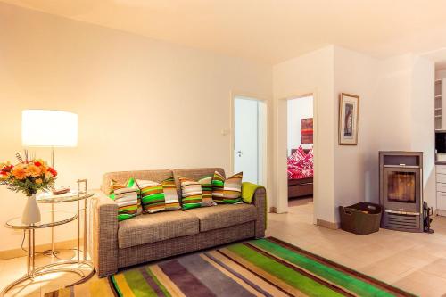 a living room with a couch and a fireplace at Sonnentraum in Zinnowitz