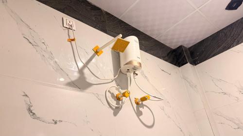 a shower in a bathroom with a white tub at Shri Hit Maya Dham in Vrindāvan