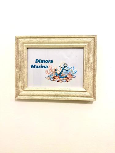 a picture of an anchor in a frame on a wall at Le Statuine Dimore Diffuse in Barletta