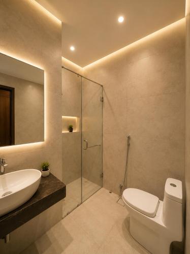 a bathroom with a toilet and a sink and a shower at Prime Stay Bosan Hotel Multan in Multan