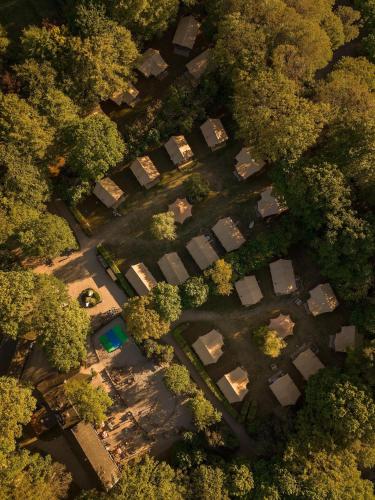 an overhead view of a park with trees and buildings at Gooise Heide in Huizen
