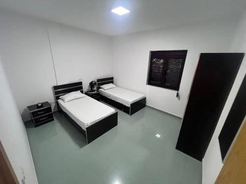 an overhead view of a room with two beds at Vila Vollga in Durrës