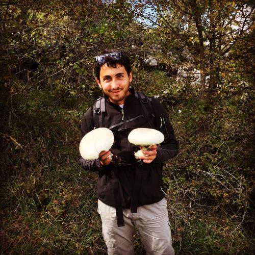 a man holding two frisbees in his hands at La Poiana in Barrea