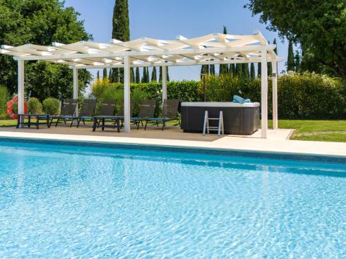 a pool with a gazebo and a table and chairs at Villa Vineyard View by Interhome in San Gimignano