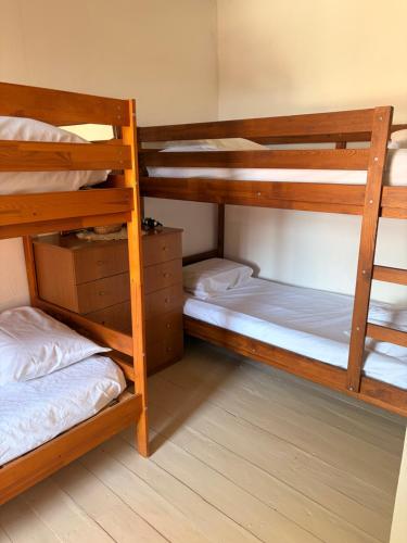 two bunk beds in a small room withthritisthritisthritisthritisbestosbestosbestosbestos at Thassos Traditional House in Limenaria