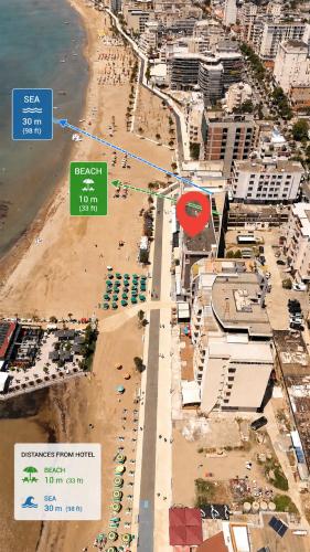 an aerial view of a beach with buildings and the ocean at SeaView Vacation Rooms in Durrës