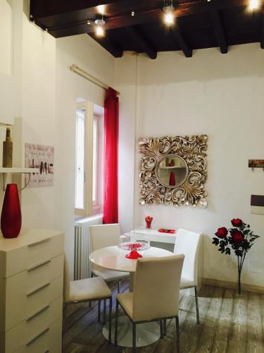 a dining room with a table and chairs at B&S Suite Colosseo in Rome