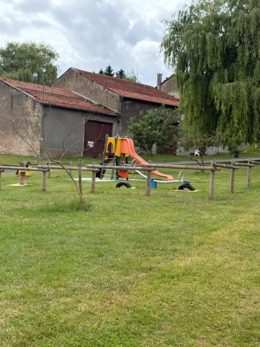 a park with a playground with a slide at Les Croisés&Spa in Azannes-et-Soumazannes