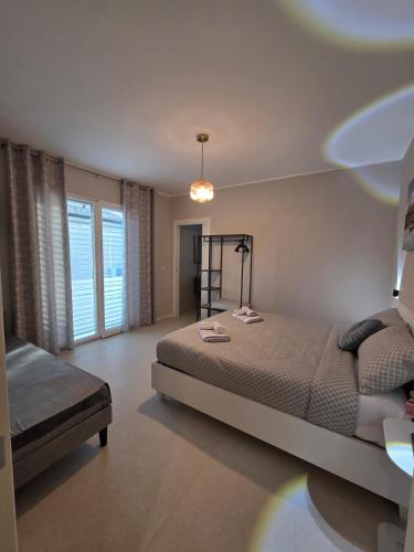 a bedroom with a large bed and a window at Aria venice rooms in Tessera